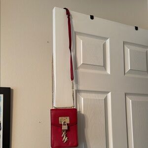 DKYN purse with a strap approximately 20 in long. Never used. New without tags.